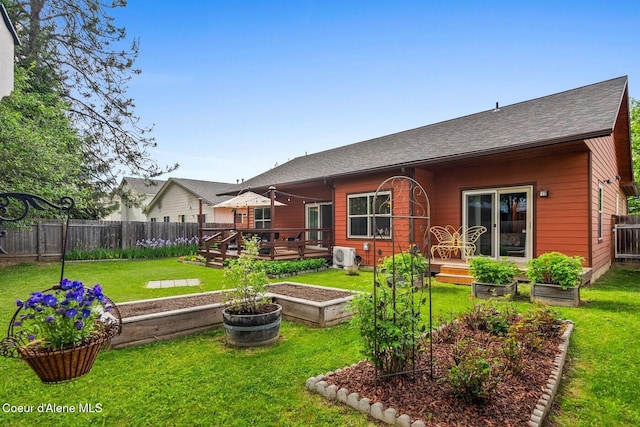 1625 Sequoia, Sandpoint, ID 83864 - back of property featuring a vegetable garden, a wooden deck, and a shingled roof
