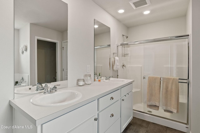 2962 N Swainson Ln, Liberty Lake, WA 99019 - bathroom featuring a stall shower, double vanity, tile patterned flooring, and recessed lighting