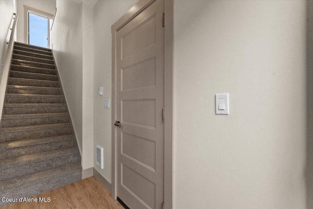3026 Suzanne C, Coeur Dalene, ID 83815 - stairs with wood finished floors and baseboards