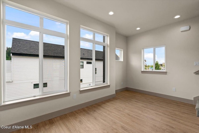 3026 Suzanne C, Coeur Dalene, ID 83815 - unfurnished room featuring healthy amount of natural light, light wood-style floors, and recessed lighting