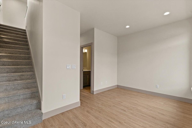 3026 Suzanne C, Coeur Dalene, ID 83815 - empty room featuring light wood finished floors, stairs, and recessed lighting