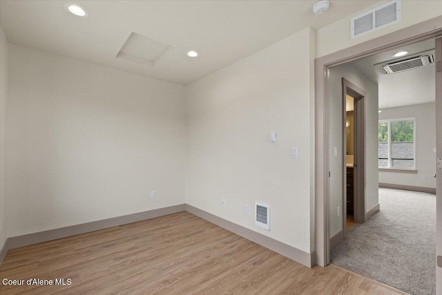 3026 Suzanne C, Coeur Dalene, ID 83815 - empty room featuring a smoke detector, light wood finished floors, and recessed lighting