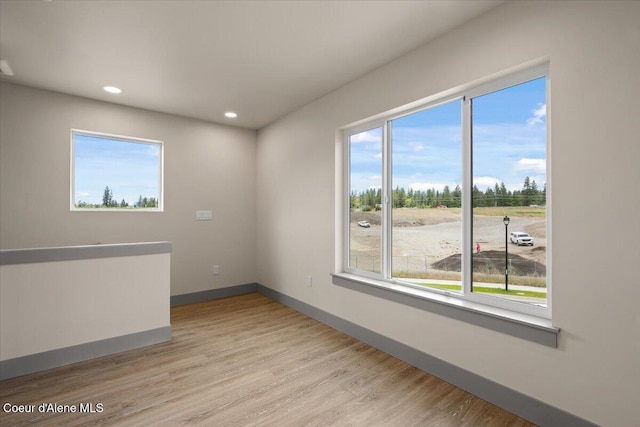 3026 Suzanne C, Coeur Dalene, ID 83815 - unfurnished room featuring light wood-type flooring and recessed lighting