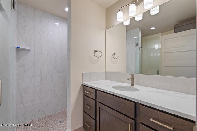 3026 Suzanne C, Coeur Dalene, ID 83815 - full bathroom with a marble finish shower, vanity, and recessed lighting