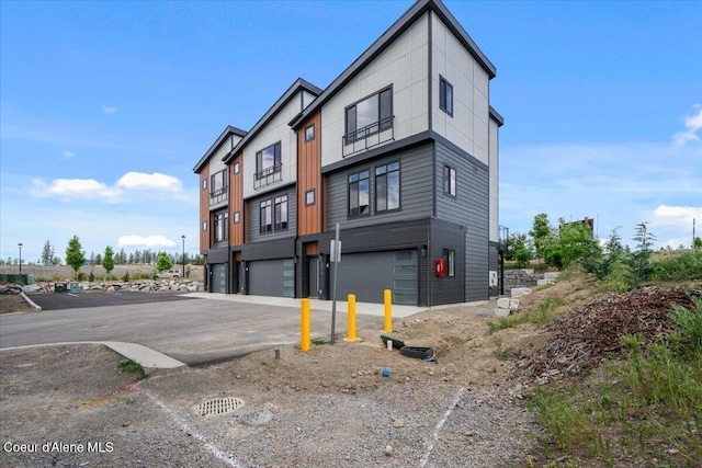 3026 Suzanne C, Coeur Dalene, ID 83815 - view of building exterior featuring a garage and driveway