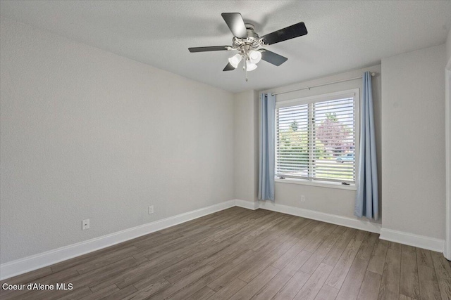 1922 E Rodkey Dr, Post Falls, ID 83854 - unfurnished room featuring dark wood-style flooring and ceiling fan