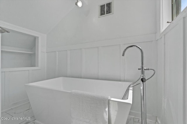 1922 E Rodkey Dr, Post Falls, ID 83854 - full bath featuring a decorative wall, marble finish floors, a soaking tub, and a wainscoted wall