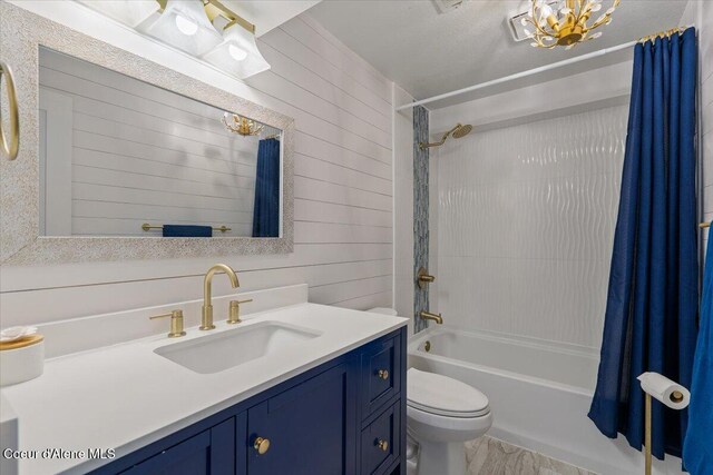 1922 E Rodkey Dr, Post Falls, ID 83854 - bathroom with shower / bath combo, a chandelier, vanity, wooden walls, and wood finished floors