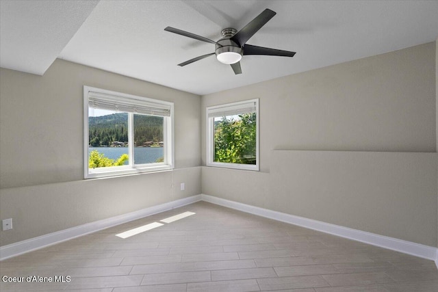 1922 E Rodkey Dr, Post Falls, ID 83854 - empty room featuring wood finished floors and a ceiling fan
