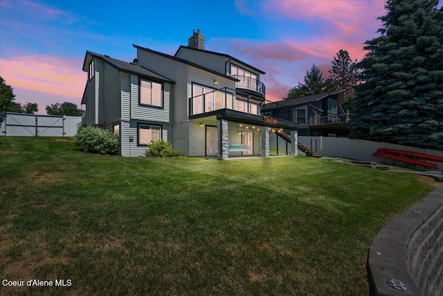 1922 E Rodkey Dr, Post Falls, ID 83854 - back of property featuring stairs, a chimney, and a wooden deck