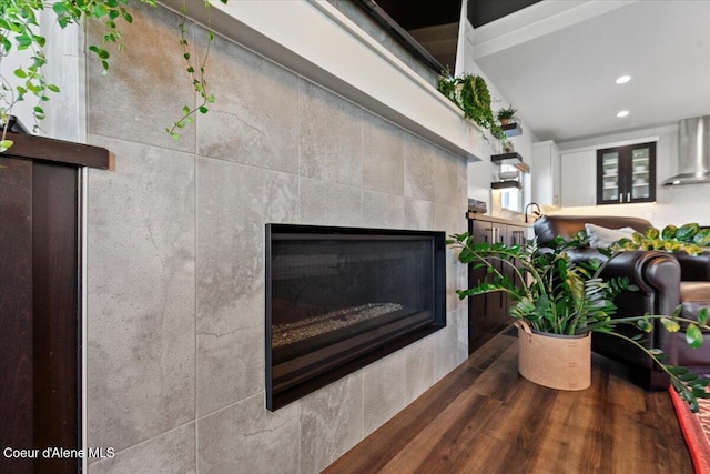 3811 N Foxtail Rd, Post Falls, ID 83854 - detailed view of wall chimney exhaust hood, a tile fireplace, and recessed lighting