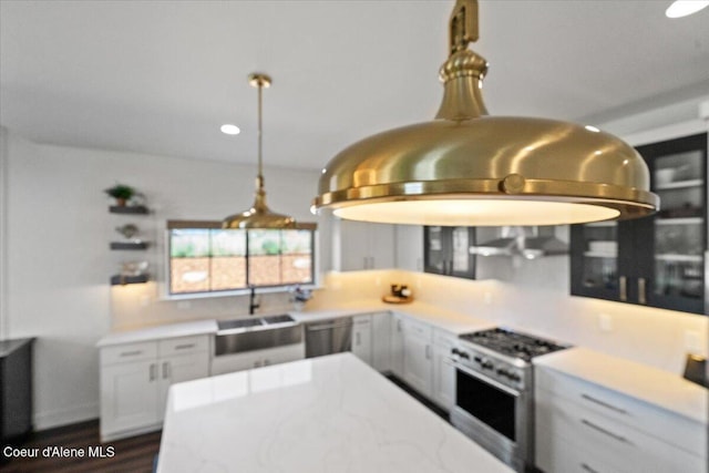 3811 N Foxtail Rd, Post Falls, ID 83854 - kitchen featuring appliances with stainless steel finishes, light countertops, and dark wood-type flooring
