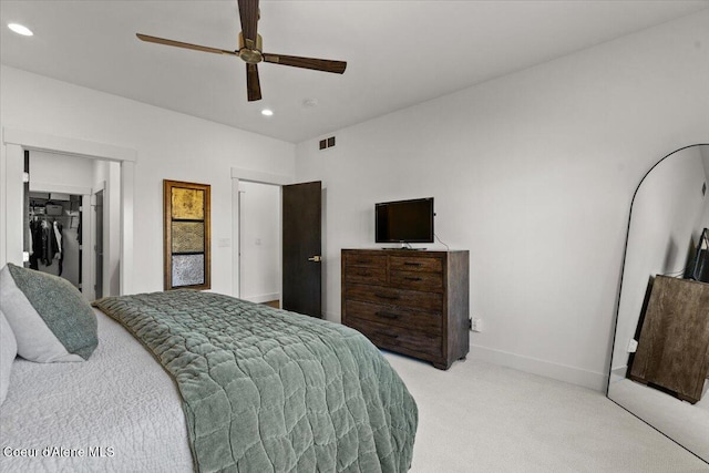 3811 N Foxtail Rd, Post Falls, ID 83854 - bedroom featuring light carpet, recessed lighting, a ceiling fan, a closet, and a walk in closet