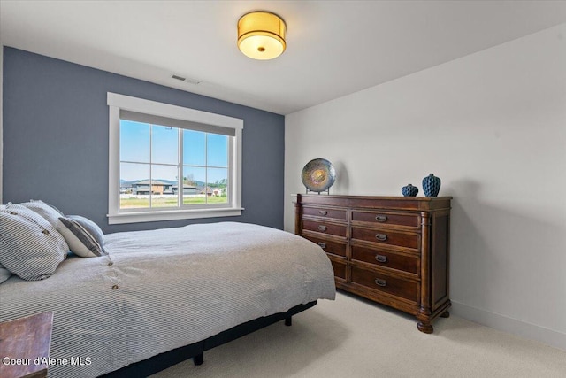 3811 N Foxtail Rd, Post Falls, ID 83854 - bedroom with light carpet and baseboards