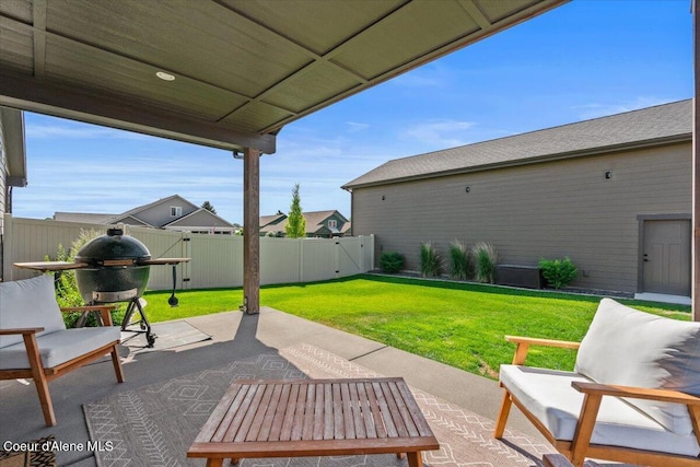 3811 N Foxtail Rd, Post Falls, ID 83854 - fenced backyard featuring a patio area and a gate