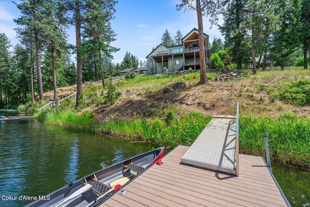 11667 N Eastshore Dr, Hayden, ID 83835 - dock area featuring a water view and view of wooded area