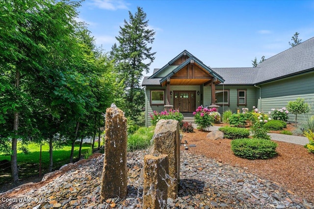 11667 N Eastshore Dr, Hayden, ID 83835 - craftsman house with covered porch and a shingled roof