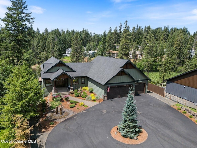 11667 N Eastshore Dr, Hayden, ID 83835 - view of front of property featuring covered porch, driveway, and a garage