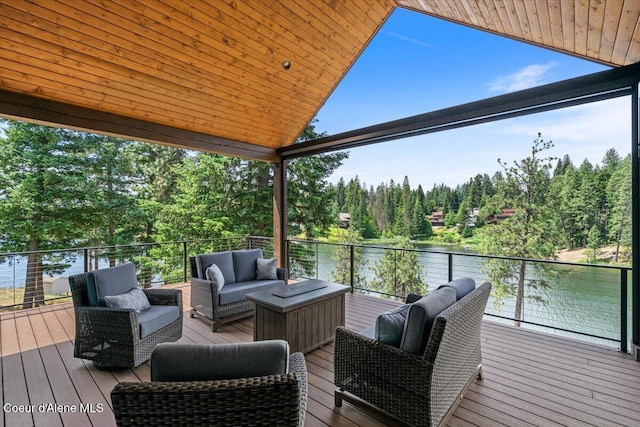 11667 N Eastshore Dr, Hayden, ID 83835 - wooden terrace with a water view and an outdoor hangout area