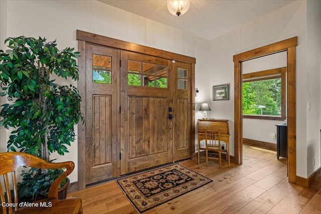 11667 N Eastshore Dr, Hayden, ID 83835 - foyer with hardwood / wood-style floors and baseboards