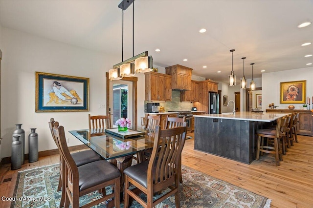 11667 N Eastshore Dr, Hayden, ID 83835 - dining room featuring light wood-type flooring and recessed lighting
