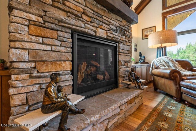 11667 N Eastshore Dr, Hayden, ID 83835 - detailed view of wood finished floors and a fireplace