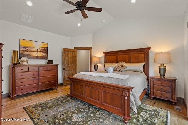 11667 N Eastshore Dr, Hayden, ID 83835 - bedroom with vaulted ceiling, light wood finished floors, recessed lighting, and ceiling fan