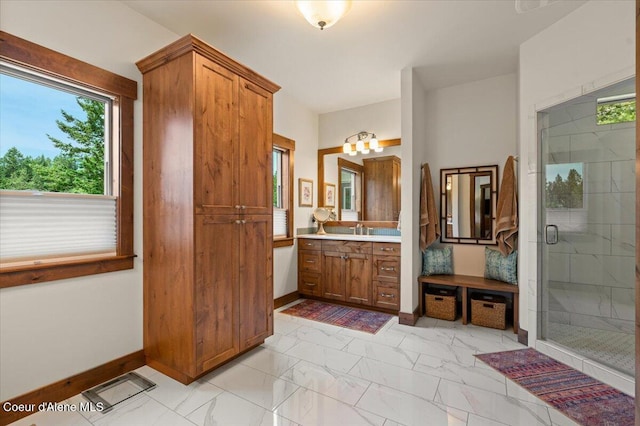 11667 N Eastshore Dr, Hayden, ID 83835 - full bathroom with vanity, marble finish floors, and a shower stall