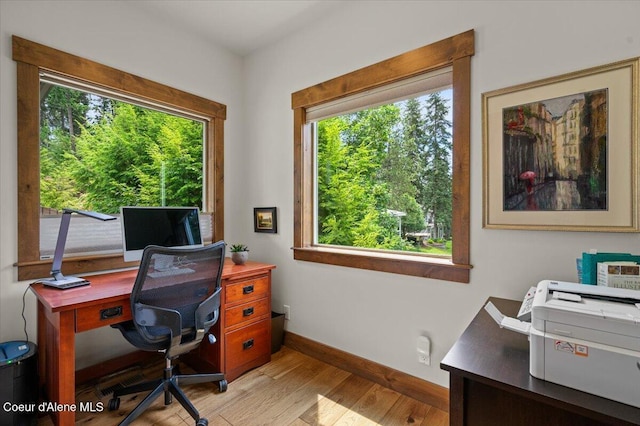 11667 N Eastshore Dr, Hayden, ID 83835 - home office featuring healthy amount of natural light and light wood finished floors