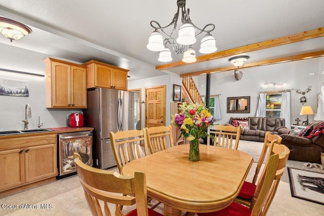 20264 Coeur Dalene River Rd, Kingston, ID 83839 - dining room with a chandelier and beamed ceiling