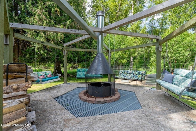 20264 Coeur Dalene River Rd, Kingston, ID 83839 - view of patio / terrace with an outdoor living space with a fire pit