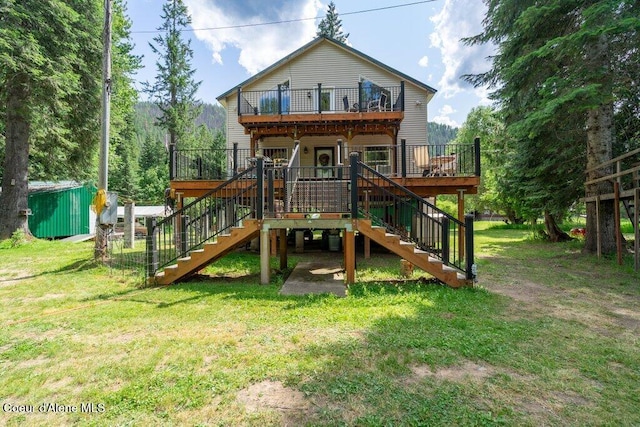 20264 Coeur Dalene River Rd, Kingston, ID 83839 - rear view of property with stairs, a yard, a wooden deck, and an outdoor structure