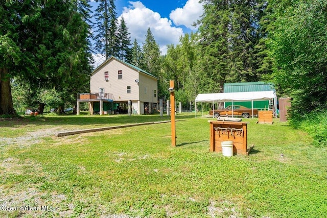 20264 Coeur Dalene River Rd, Kingston, ID 83839 - view of green lawn with a carport