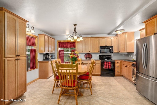 20264 Coeur Dalene River Rd, Kingston, ID 83839 - kitchen with black appliances, light flooring, a chandelier, and hanging light fixtures