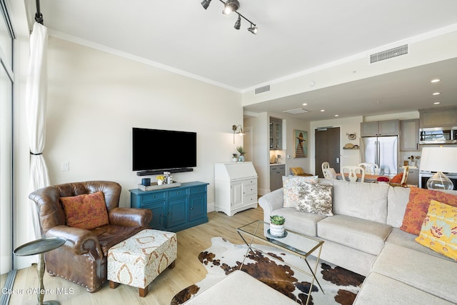 201 N 1st St # 1006, Coeur Dalene, ID 83814 - living area featuring ornamental molding and light wood-type flooring