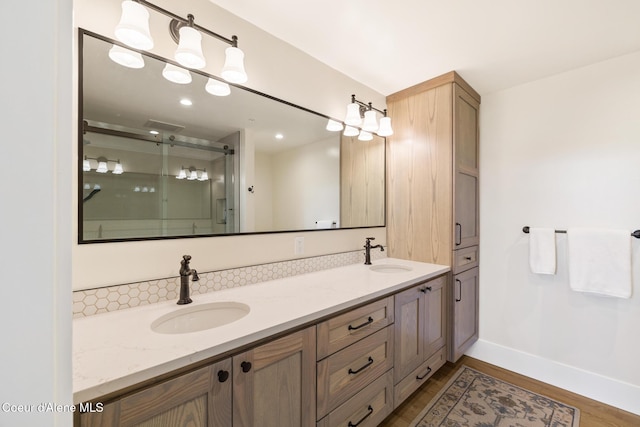 201 N 1st St # 1006, Coeur Dalene, ID 83814 - full bathroom with double vanity, wood finished floors, and a shower stall