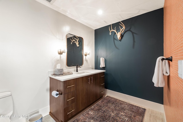 201 N 1st St # 1006, Coeur Dalene, ID 83814 - half bathroom with vanity and toilet