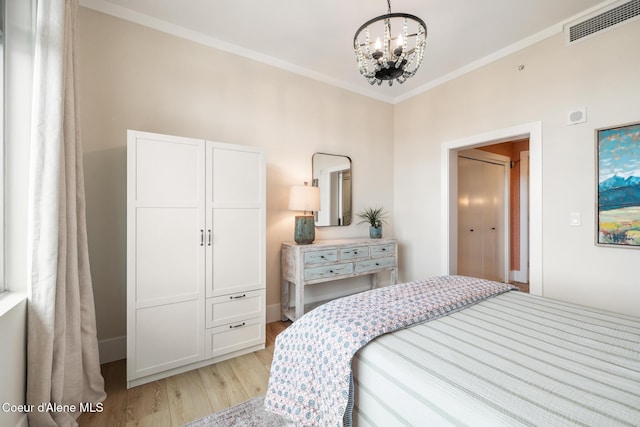 201 N 1st St # 1006, Coeur Dalene, ID 83814 - bedroom with light wood-style floors, a chandelier, and crown molding