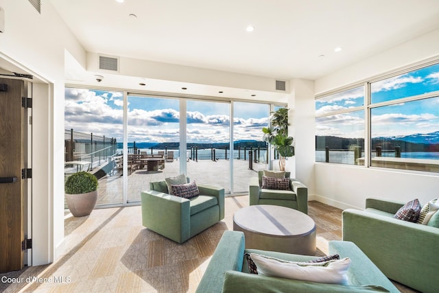 201 N 1st St # 1006, Coeur Dalene, ID 83814 - sunroom / solarium with plenty of natural light and a water view