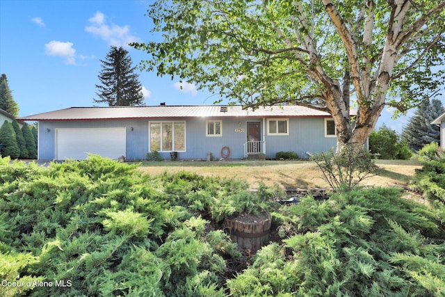 1750 N Havichur Loop, Post Falls, ID 83854 - single story home with an attached garage and a metal roof