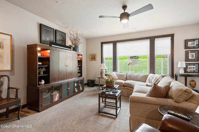4583 Greenchain Loop Unit 5, Coeur Dalene, ID 83814 - carpeted living area featuring a ceiling fan