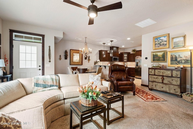 4583 Greenchain Loop Unit 5, Coeur Dalene, ID 83814 - living room featuring a ceiling fan, a chandelier, and light carpet