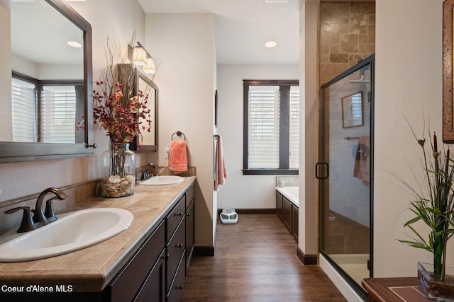 4583 Greenchain Loop Unit 5, Coeur Dalene, ID 83814 - bathroom with double vanity, wood finished floors, plenty of natural light, a shower stall, and recessed lighting