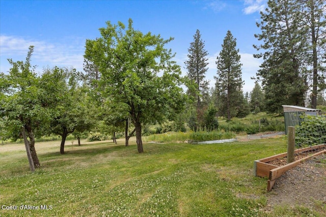 14250 W Sunmeadow Rd, Worley, ID 83876 - view of grassy yard with a vegetable garden