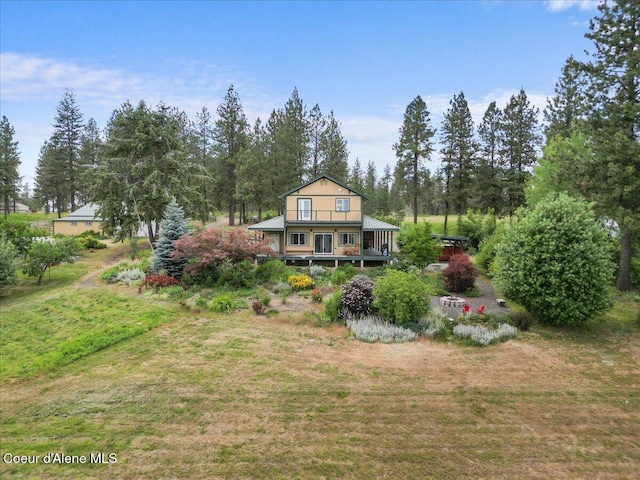 14250 W Sunmeadow Rd, Worley, ID 83876 - rear view of property with a lawn