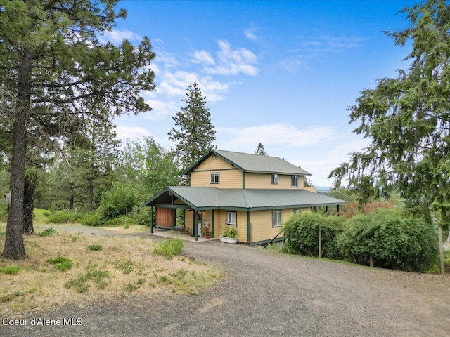 14250 W Sunmeadow Rd, Worley, ID 83876 - view of front facade with driveway and a metal roof