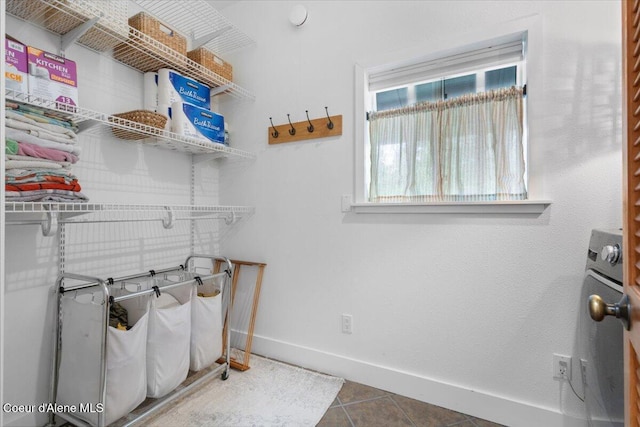 14250 W Sunmeadow Rd, Worley, ID 83876 - laundry room featuring baseboards and tile patterned flooring