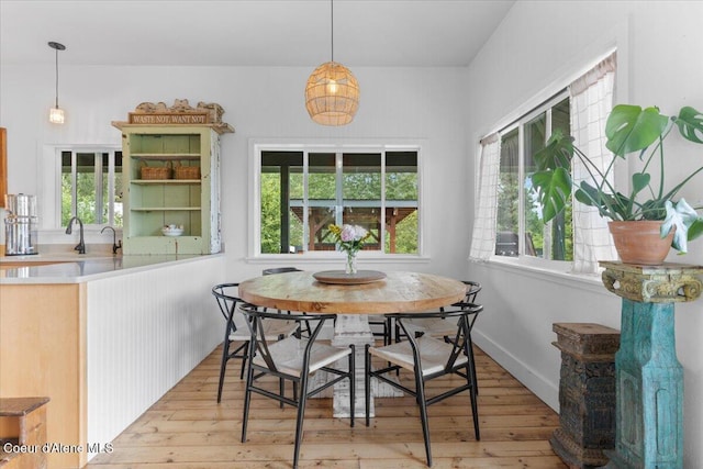14250 W Sunmeadow Rd, Worley, ID 83876 - dining area featuring light wood-style flooring and healthy amount of natural light