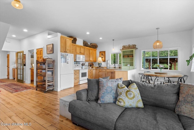 14250 W Sunmeadow Rd, Worley, ID 83876 - living area featuring light wood-type flooring and recessed lighting