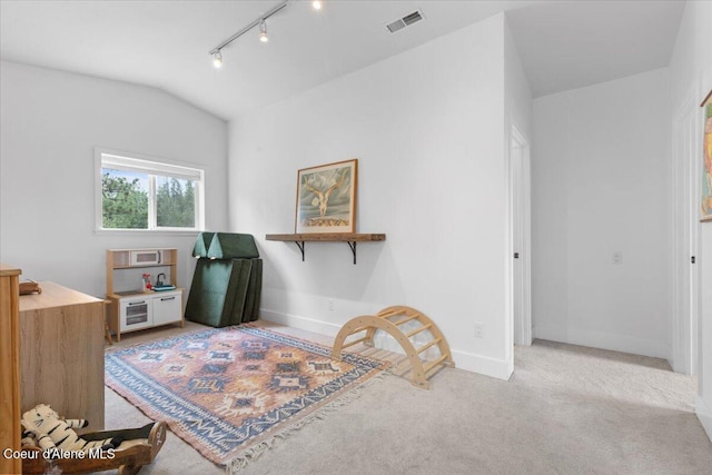 14250 W Sunmeadow Rd, Worley, ID 83876 - sitting room featuring rail lighting, lofted ceiling, and carpet flooring